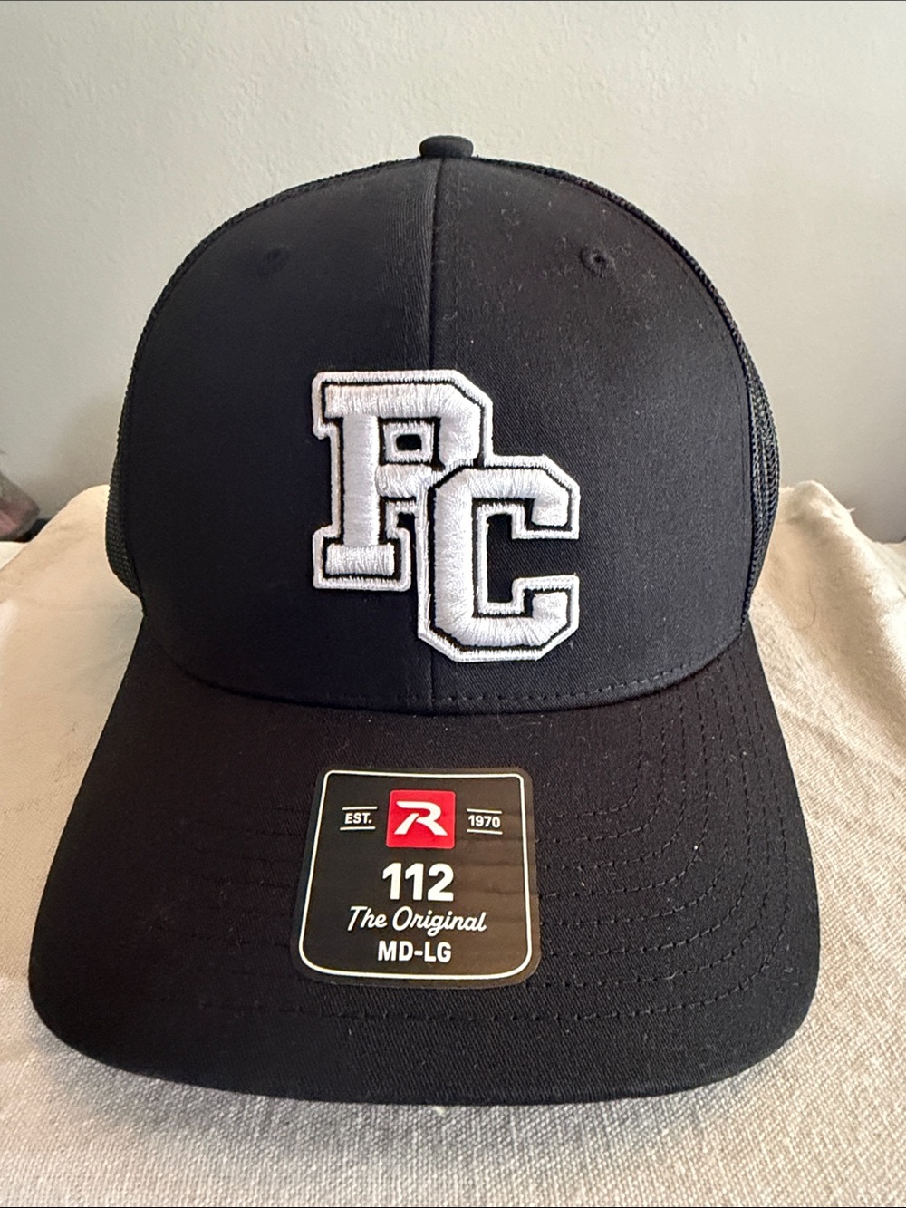 Black PC Embroidered Trucker Hat by Richardson
